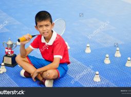 stock-photo-asian-boy-badminton-championship-549945946