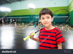 stock-photo-little-boy-taking-badminton-racket-in-training-class-at-the-gym-270356651